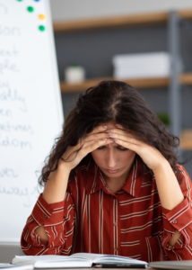 Teacher stressed by excessive workload.